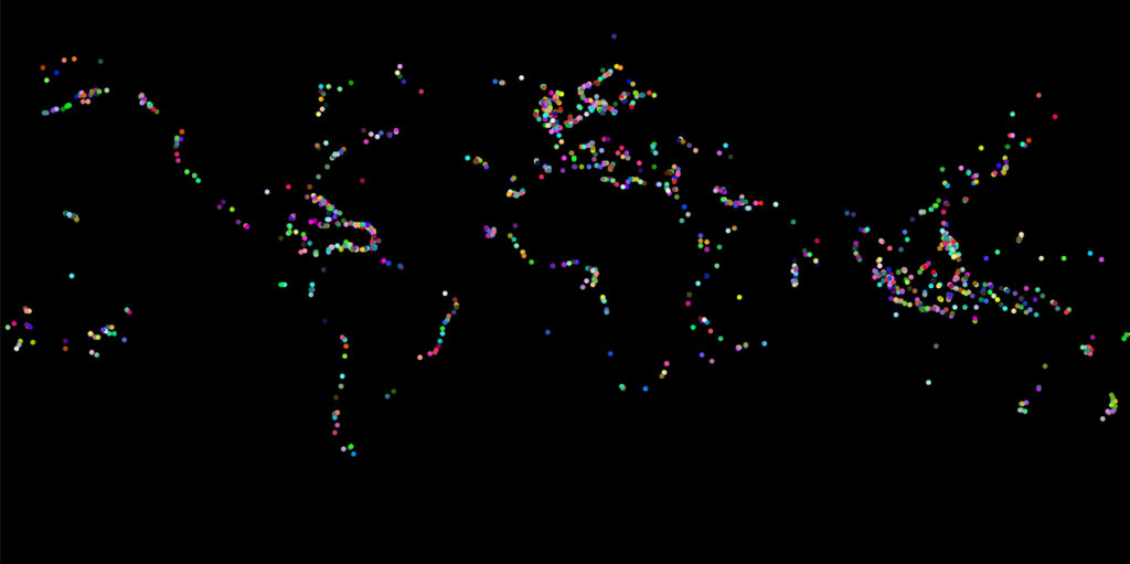 On a black background, dots in random colors surround the dark land masses of continents. The shapes of South America and Africa are most apparent.